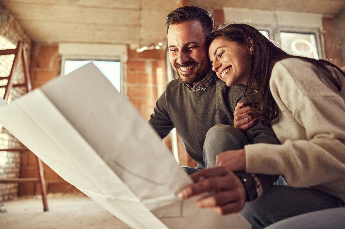 Homeowners reviewing plans during a remodel